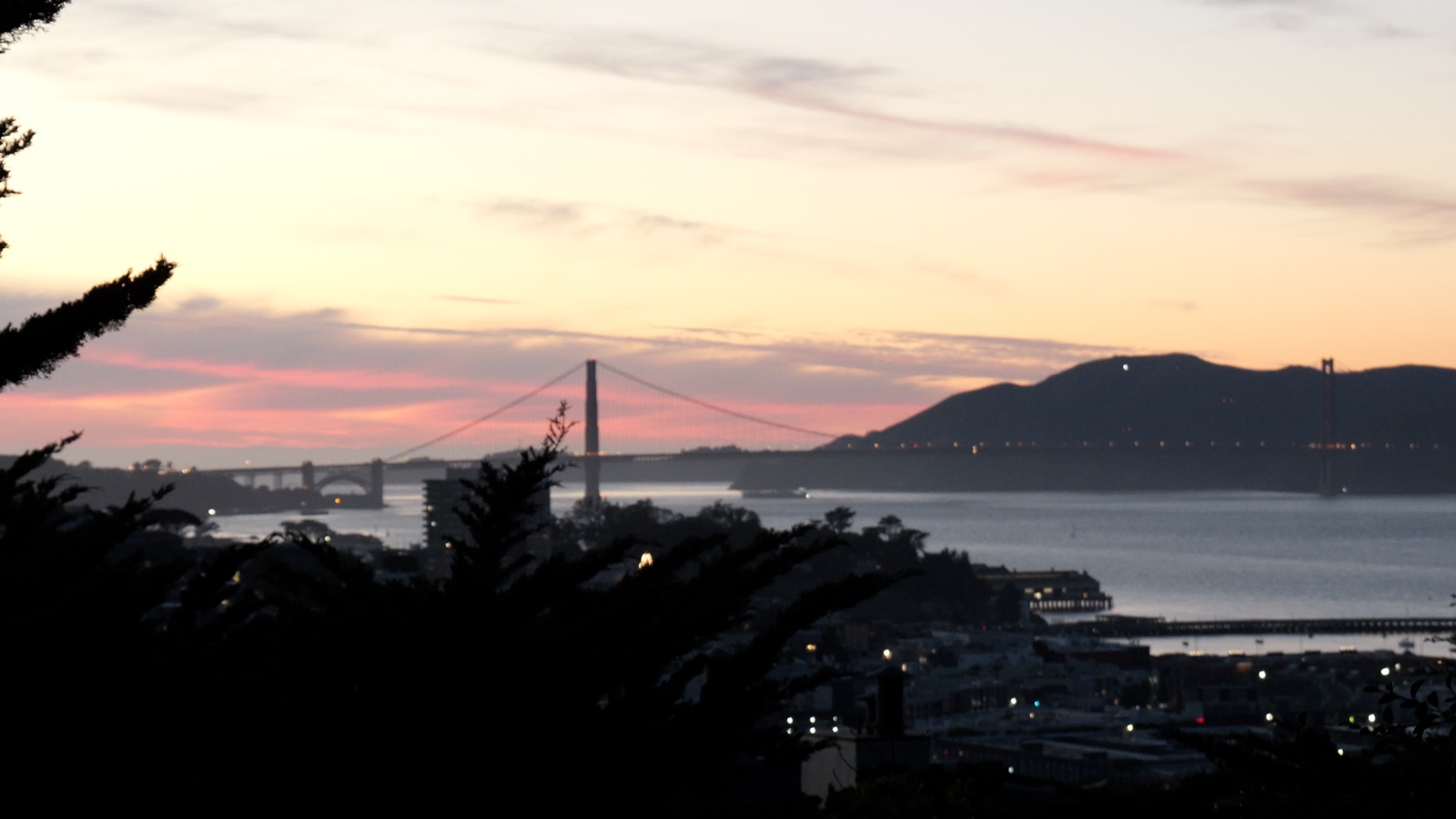 Sunset view over the bay and the Golden Gate Bridge from Telegraph Hill